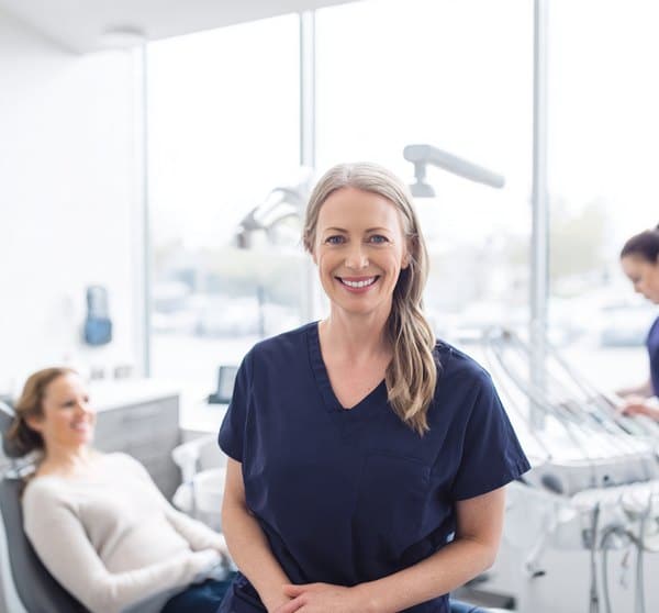 Halton Village Dental clinician with a patient in the treatment room, open seven days a week in Georgetown